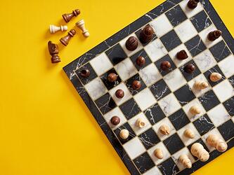 chess board against yellow background